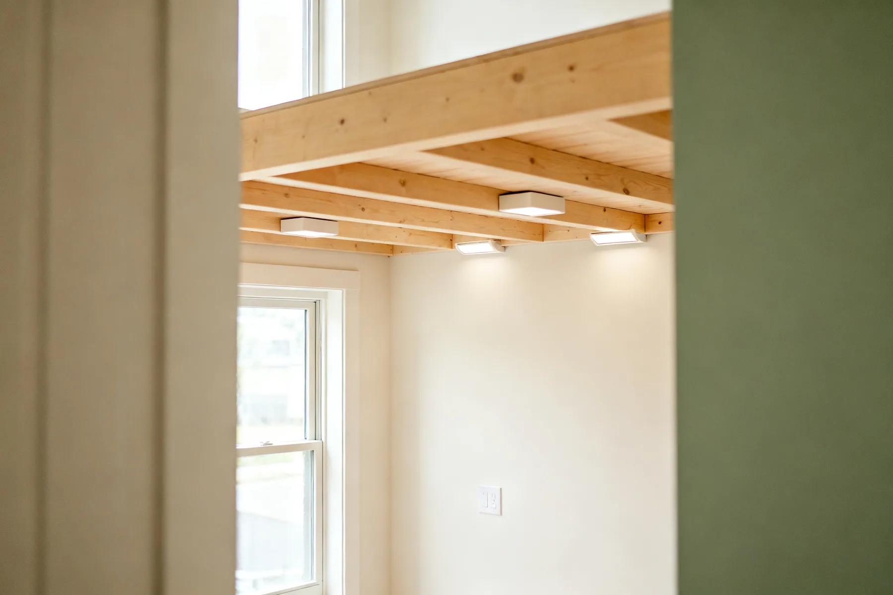 Ceiling joists are not floor joists Loft joists with light boxes distributed evenly across several joists near the wall plate, nothing heavy in the middle of a span