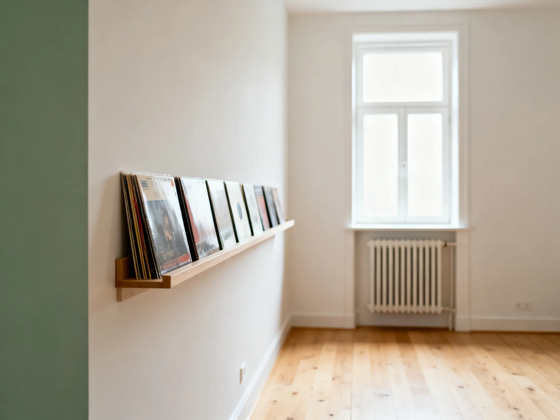Heat is what actually destroys vinyl A record shelf on an interior wall well away from a bright window and a radiator visible on the far side of the room